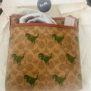 Coach crossbody dinosaur rexi